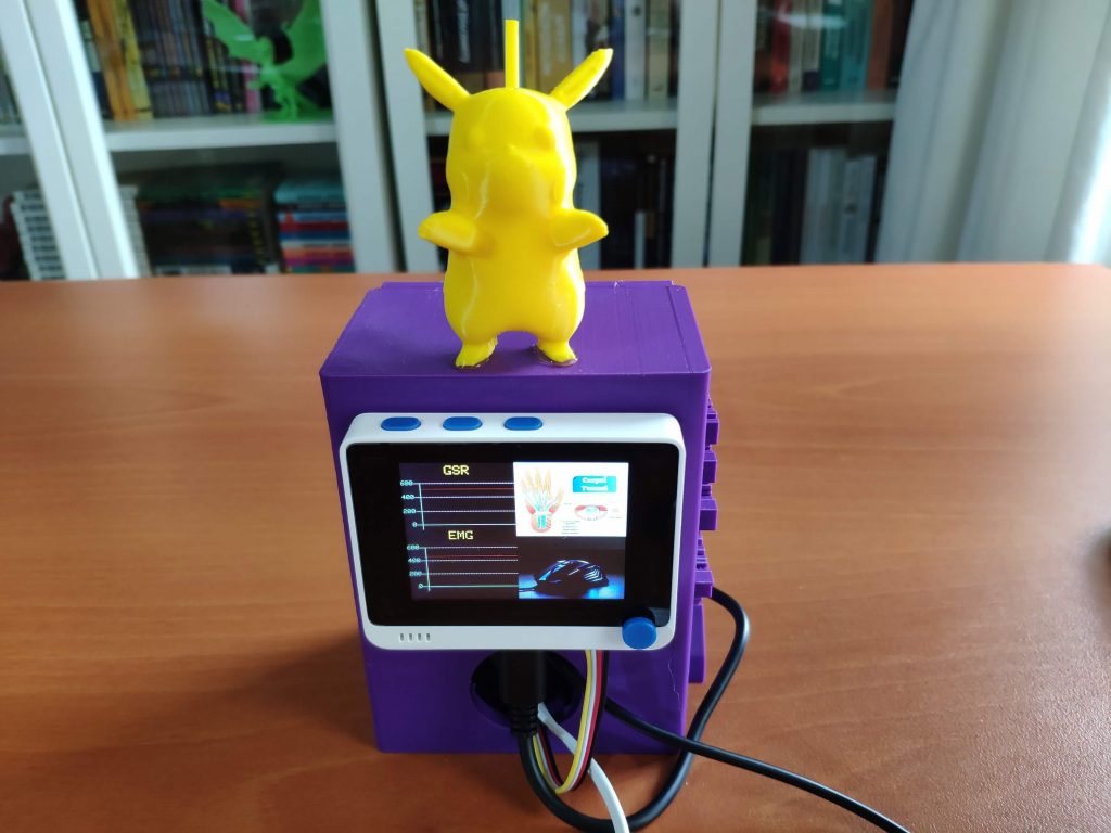 A purple electronic device with a yellow Pikachu on the top
