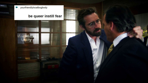 A man angrily holding another man by the back of the neck with the caption "be queer instill fear"