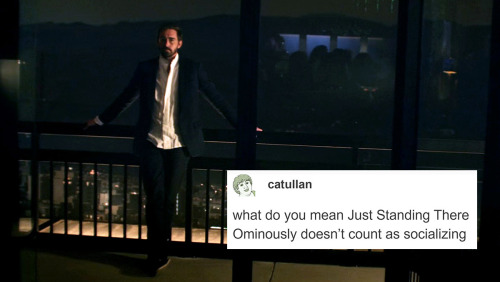 A man standing on his balcony with the caption "what do you mean just standing there ominously doesn't count as socializing"